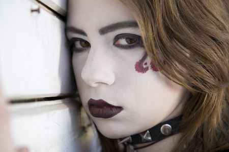 Young Alternative Girl Near A Wallの写真素材