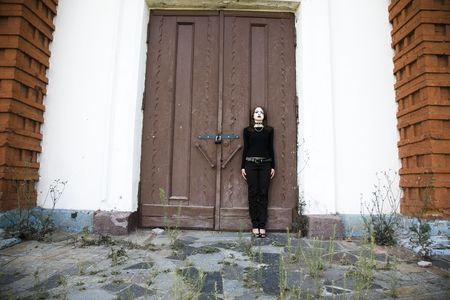 Gothic Style Girl Near A Doorの写真素材