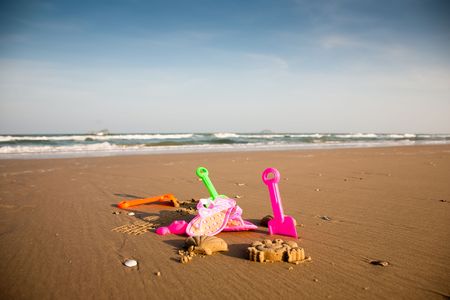 Colrful children toys on the beach. Childhood collection.の写真素材