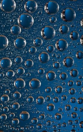 Blue water-drops on the glass