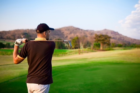Golfer teeng of on a beautiful summer dayの写真素材