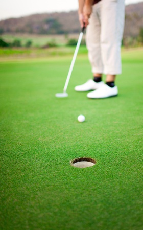 Golf player on the greenの写真素材