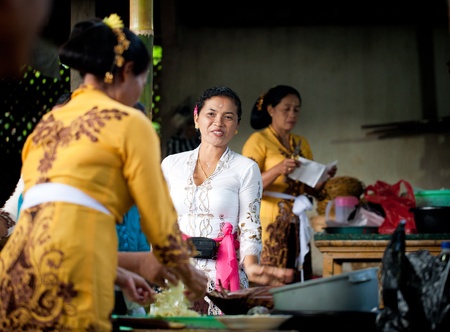 GIANYAR, BALI, INDONESIA- MAY 21: Unidentified villagers bring gifts to the gods at the Balinese Temple during the Odalan Festival on May 21, 2011 in Gianyar, Bali, Indonesia. のeditorial素材