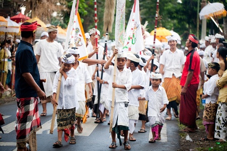 GIANYAR, BALI, INDONESIA- MAY 21: Unidentified villagers bring gifts to the gods at the Balinese...