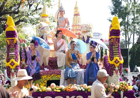 CHIANG MAI, THAILAND - FEBRUARY 4: Womans on flower decorated cart on Chiang Mai 36th Flower...