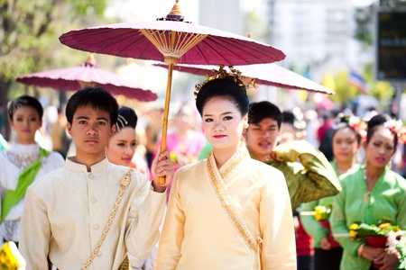 CHIANG MAI, THAILAND - FEBRUARY 4: Traditionally dressed couple in procession on Chiang Mai 36th Flower Festival on February 4, 2012 in Chiang Mai, Thailandのeditorial素材