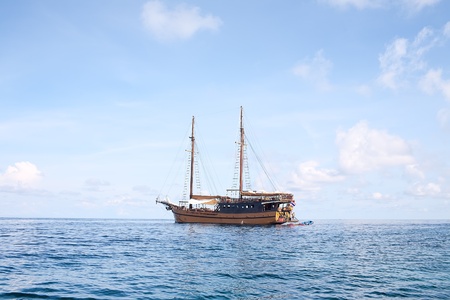 Antique Sailboat Anchored in the Ocean