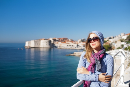 Tourist woman against old town of Dubrovnikの写真素材