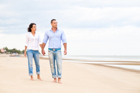 Portrait of a happy couple at the beachの写真素材