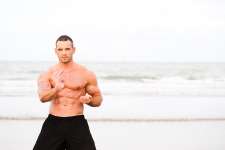 Man doing exercises at the beachの写真素材