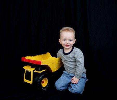 Cute little boy with his truckの写真素材