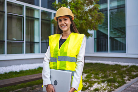 Smiling female safety engineer outdoors