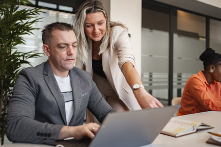 Man and Woman Looking at Laptopの写真素材