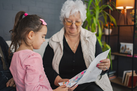 Joyful moment of grandma and granddaughter at home