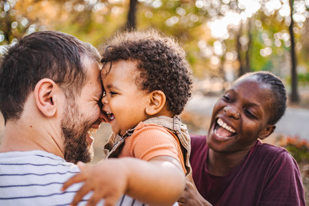 Joyful Laughter: Family Fun in the Fallの写真素材