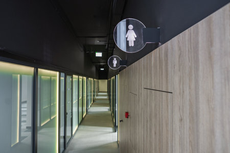 Long Hallway With Toilet Signの写真素材