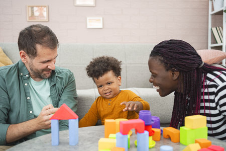 Multiracial family enjoys colorful blocks at home