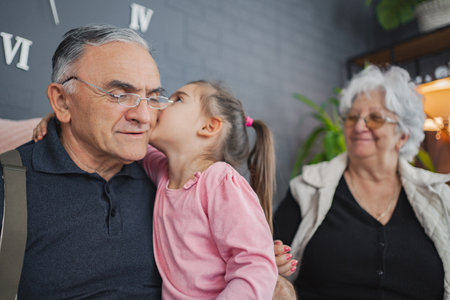 Grandfather and granddaughter share a sweet moment