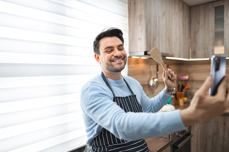 Man Taking Selfie in Kitchenの写真素材