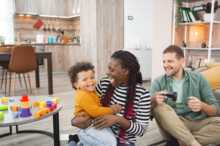 Multiracial family enjoying playtime together in a cozy living room