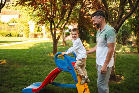Joyful moments in the garden with father and son