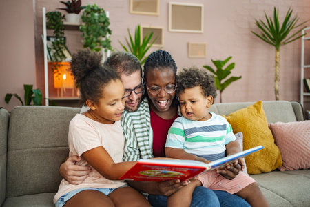 Family reading together in a cozy living roomの写真素材
