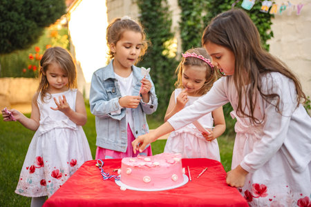 Sweet celebration with friends at a joyful garden partyの写真素材