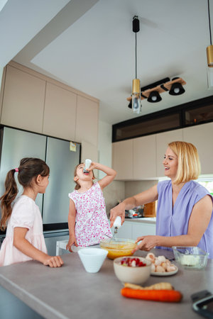 Cooking fun with kids in a bright kitchen wonderlandの写真素材