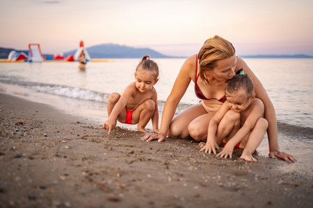 Summer fun at the beach in Greece with joyful toddlersの写真素材