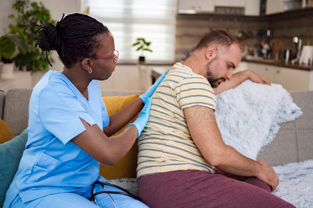 Caring nurse provides comfort during an at-home visit