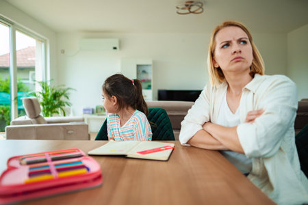 Conflict during family time in a bright living roomの写真素材