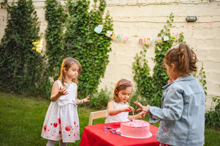 Joyful celebration with little girls at a birthday party