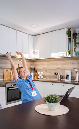 Tired doctor relaxing after a stressful online consultation from homeの写真素材