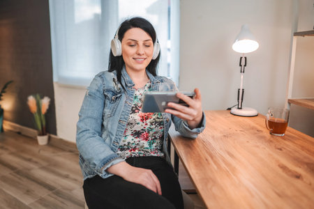 Young woman attending a video call while working from homeの写真素材