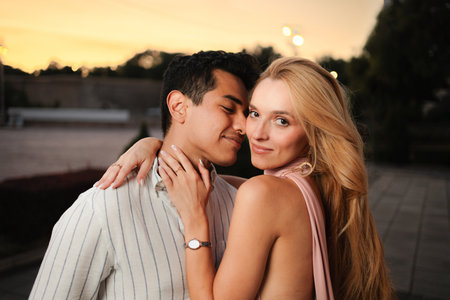 Romantic sunset moment between a couple in an outdoor settingの写真素材