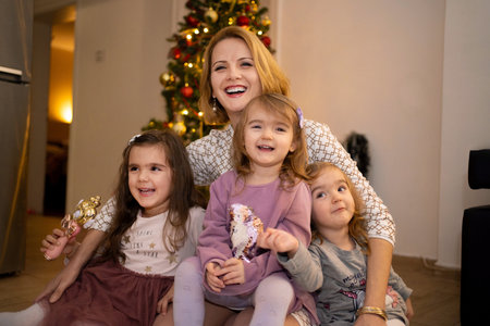 Joyful moments with children during a festive gathering at homeの写真素材