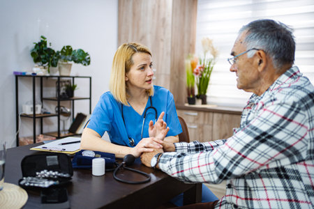 Compassionate care in a cozy senior health consultationの写真素材