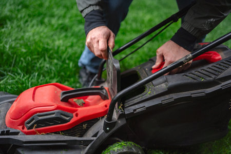 Caring for the lawn with meticulous grass trimming on a bright sunny afternoon