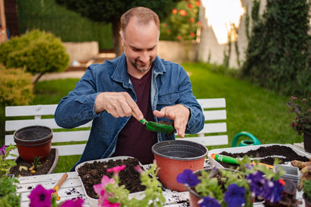 Enjoying gardening on a sunny afternoon in the backyardの写真素材