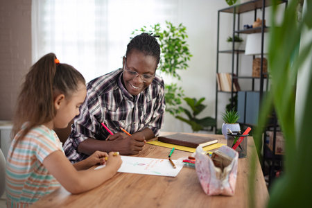 Creative moments shared between a mentor and a young artist