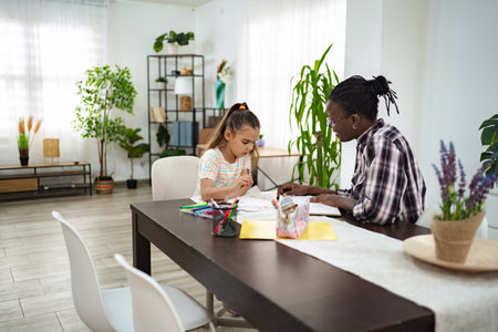 Creative bonding moments during art time at homeの写真素材