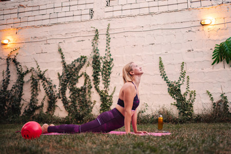 Mother enjoying yoga after childbirth to regain fitness
