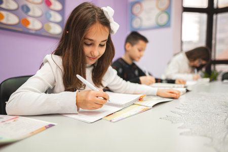 Group of elementary students studying at language school