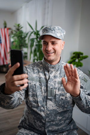 American soldier making a video call with his familyの写真素材