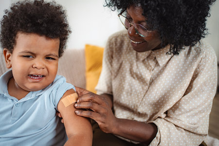 Doctor checking child's heartbeat with stethoscopeの写真素材