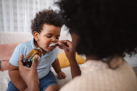 Doctor visiting sick child at homeの写真素材
