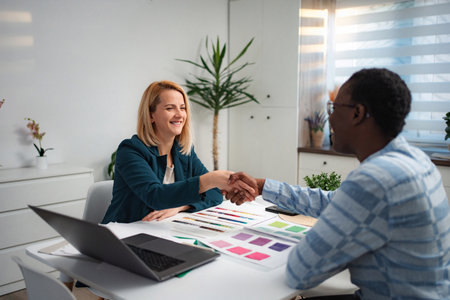Businesswomen shaking hands after successful meetingの写真素材
