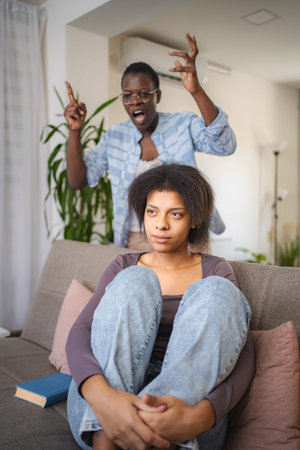 Mother Scolding Teenage Daughter at Homeの写真素材