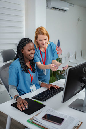 Female medical staff working on computer in hospital office