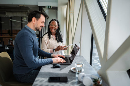 Coworkers collaborating remotely laughing while discussing business ideas